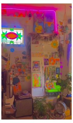 a room filled with lots of clutter and plants next to a neon colored window