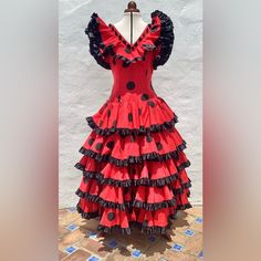 Authentic Spanish Dress From Andalucia In Southern Spain. Like One Madonna Wears In “La Isla Bonita” Vintage Flamenco Gypsy Dress Not A Standard Size, Approximate Size: 12uk. 8usa. 40eu Bust 36(91.5cm). Natural Waist 30”(76cm). Hips 42”(106.5cm) Back Shoulder To Waist 14.5”(36.5cm) Back Shoulder To Hip 24”(61cm) Back Shoulder To Hem 52”(132cm) Please Check All The Measurements Or It Might Not Fit!! Fabulous Red Dress With Large Black Polkadots And Satin Ribbons Well Made, Good Quality Dress Cotton Mix Fabrics - Machine Washable Excellent Vintage Condition Flamenco/Fiesta/Feria/Performance Skirt Full Circle. Full Length 5 Tiers Of Frills Edged With Black Satin Rib Traditional Spanish Dress, Jalisco Dress, Spanish Dress, Flamenco Dress, Southern Spain, Satin Ribbons, Quality Dresses, Dress Cotton, Size 8 Dress