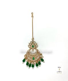 Indian maang tikka, silver foiled kundans papati billa. Pota emeralds, CZs and hydro beads papati bottu. Traditional Indian jewelry. Indian passa in soft gold plating. Good quality.