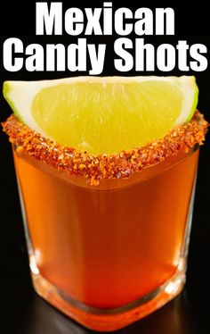 Close up of a shot glass filled with a Mexican Candy Shot and a lime wedge on a black background. Mexican Candy Drink, Mazzios Ranch Recipe, Mexican Candy Shots, Homemade Crunchwrap, Candy Shots, Mix Drinks, Xmas 2022, Mexican Candy