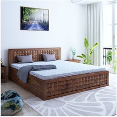 a bedroom with white walls and wooden furniture