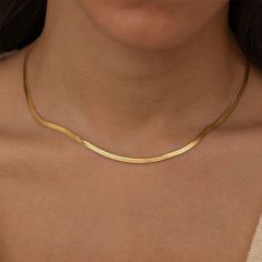 The 18K gold plated herringbone necklace features a delicate, flat snake chain crafted from stainless steel, making it a perfect dainty accessory for women seeking a touch of timeless elegance. 🌟Stainless steel  💛18K PVD gold plated 💦 Fully waterproof 🌟Hypoallergenic 🌟Tarnish free 💖Designed for 24/7 wear ✨Nickel and Lead free 🧡🌟 All jewellery comes inside a velvet drawstring pouch 🌟🧡 Necklace length: 42cm + 5cm extender Herringbone Necklace, Drawstring Pouch, Choker Necklaces, Style Necklace, Snake Chain, Herringbone, Timeless Elegance, Necklace Etsy, Necklace Lengths