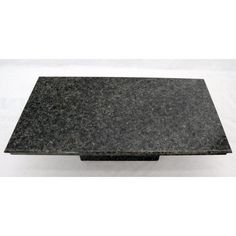 a black granite table top on a white background