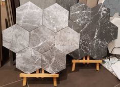 several hexagonal marble tiles are on display