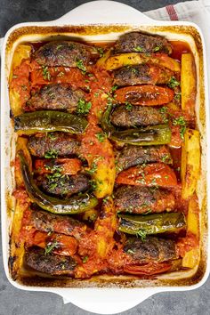 a casserole dish filled with meat and vegetables