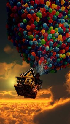 a house floating in the air surrounded by balloons