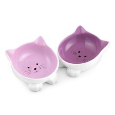 two bowls with cats on them sitting next to each other