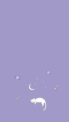 a cat sitting on top of a purple surface next to stars and moon shapes in the sky