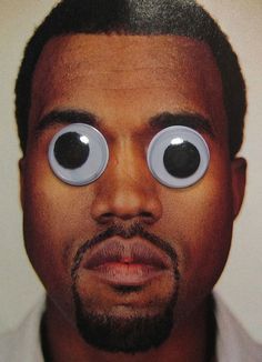 a close up of a man with two eyes on his face and an eyeball in front of him