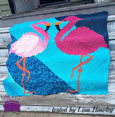 a crocheted blanket with two flamingos on it and the words, tested by lasa hatley