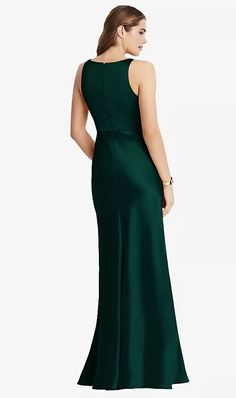 a woman in a long green dress