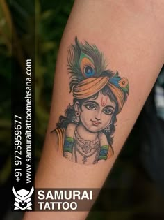 a woman with a peacock headdress on her arm is shown in this tattoo photo