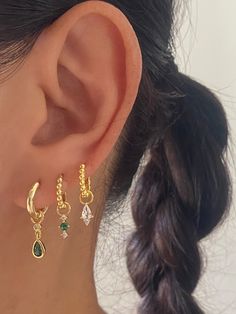 These Premium earrings are made of 18k gold plated on 925 sterling silver hoops with choice of premium cubic zirconia charms made of 925 sterling silver with 18k gold plated.You can choose different size/style of hoops in the drop down menu. • Sold as a Pair (3 pairs come with Anett Jewellery Box) A. Green Teardrop CharmsMaterial: 925 Sterling Silver, Gold Plated, Premium zirconiaCharm size: 15mm in lengthSold as a pairHypoallergenicNickel FreeB. Tiny Green CharmsMaterial: 925 Sterling Silver, G Stacked Gold Earrings, Gold And Green Earring Set, Gold And Green Piercings, Green And Gold Ear Piercings, Emerald Earrings Layered, Green And Gold Earring Stack, Gold Earring Stack, Earrings Stack