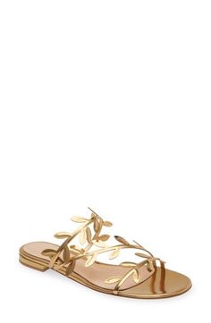 Delicate leaves flourish on the slender straps of an enchanted sandal fashioned in Italy from golden leather with a tastefully rounded toe. Leather upper, lining and sole Made in Italy Designer Shoes Chic Gold Toe Loop Sandals, Elegant Gold Beach Sandals, Gold Leaf Sandals, Elegant Gold T-strap Open Toe Sandals, Gold Open Toe Lace-up Beach Sandals, Gold Open Toe Luxury T-strap Sandals, Luxury Gold T-strap Open Toe Sandals, Sandal Fashion, Slide Sandals