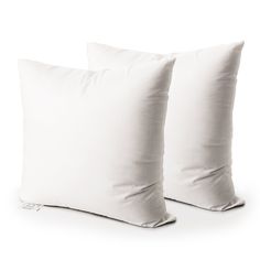 two white pillows sitting next to each other