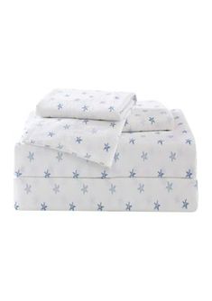 a white sheet set with blue stars on it