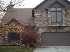 a large brick house with two garages