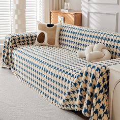 a blue and white checkered couch in a living room