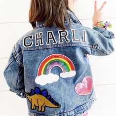 VARSITY Letter Custom Denim jacket.. is a MUST have for the coolest kids ! - personalize with name or initials - add patches for their personality ! *Choose 1 large patch : -Rainbow  -Evil Eye ( blue) -hamsa hand - LARGE unicorn -ICE CREAM Cone - Heart SUNGLASSES *Choose 2 Smaller patches : - Shamrock -pink heart - red heart - Sequin star - daisy flower  - smiley face  - smaller scale mermaid  - Gold crown  -Peace sign -smiley face Oversized custom denim for all their tiny little trinkets ! Plea Varsity Patch Ideas, Trendy Customizable Long Sleeve Denim Jacket, Customizable Denim Jacket For Fall, Playful Denim Jacket For Fall, Customizable Denim Outerwear For Fall, Customizable Long Sleeve Denim Jacket, Customizable Long Sleeve Denim Outerwear, Cute Fall Outerwear, Customizable Cute Fall Outerwear