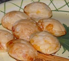 small pastries sitting on top of a yellow plate