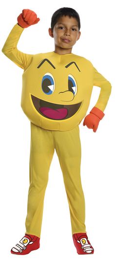 a young boy dressed as a banana with his arms in the air and smiling at the camera