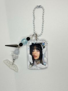 a keychain with an image of a woman on it