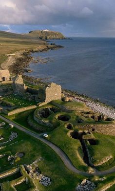 an aerial view of the ruins and surrounding water