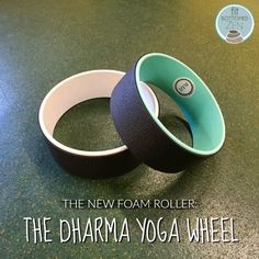 the new foam roller has two yoga wheels on it's side, and is next to each other