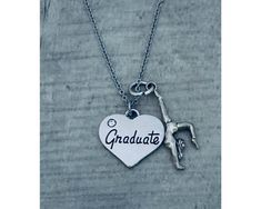 🎓GRADUATION JEWELRY- Beautiful Sports Charm Necklace for Girls 🎓GRADUATION NECKLACE - Graduate Heart charm on 17 inch stainless steel chain with 2 inch extender and your choice of sports charm 🎓GRADUATION GIFT - Perfect gift for students, seniors and graduates of middle school, high school or college. 🎓FREE JEWELRY POUCH- Jewelry Pouches Are Used To Package And Ship Our Necklaces, Ensuring The Most Beautiful Presentation Possible. 🇺🇸OUR MISSION. As a US company, we want athletes to be able Adjustable Silver Jewelry For Graduation Gift, Gift For Students, Necklace For Girls, Graduation Jewelry, Graduation Necklace, Jewelry Pouches, Sport Gymnastics, Jewelry Beautiful, Sports Accessories