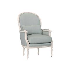 a white chair with blue upholstered fabric on the back and armrests