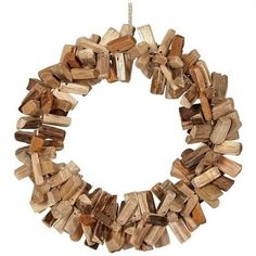 a close up of a wreath made out of wood