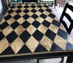 a black and white checkered table with chairs