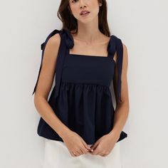 Something Special For Your Everyday Plans. This Babydoll Top Features A Fit And Flare Silhouette And A Straight Neckline. Ribbon Ties For An Extra Touch Of Femininity. Color: Navy Blue Main Fabric: 100% Polyester Lining Fabric: 95% Polyester, 5% Spandex Love Bonito, Babydoll Top, Blue Tie, Ribbon Tie, Blue Ties, Tie Top, Lining Fabric, Something Special, Fit And Flare