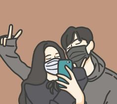 two people wearing face masks are taking a selfie with their cell phones while the woman is holding up her phone