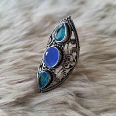 "Many have inquired about the rings I wear in this fashion, so here you go! Witchy ring in silver setting in an elongated style that measures approximately 1.75\". Let me know if you have any questions. Thanks for looking! Blessed be. *Note: While I love the style of these rings, I did not make them and therefore, cannot claim to call many of the stones anything other than pretty, faceted, glass set in silver settings. There are exceptions! Those exceptions will be noted within the listing itsel Witchy Rings, Witchy Ring, Goddess Ring, Blessed Be, Faceted Glass, The Rings, Glass Set, Jewelry Box, Jewelry Rings