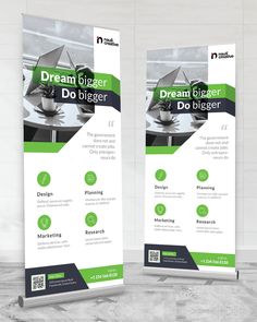 two roll up banners with green and black accents