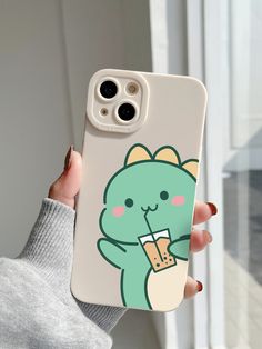 a person holding an iphone case with a cartoon character on it