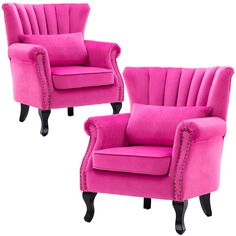 two pink chairs with black legs and studded trimmings on the armrests