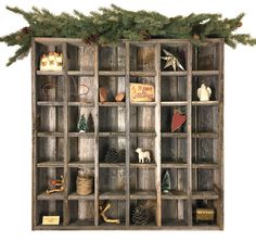 an old wooden shelf with christmas decorations on it