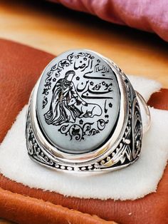 Natural Hematite Islamic Carving Natural Genuine Hadid Imam Riza,Ali bin Musa el-Rıza, Imam & Deer, 925 silver Ring Stone size is 15x20mm Back of ring is open to touch the stone Islamic Scraping,Islamic Men's Ring,Islamic Carving,Islamic Gift for Men,Islamic Unique Gift,Islamic Ring Gift,Silver Men's Ring Handmade Silver Ring,Father's Day Gift,Best Gift for Man,Gift for Muslim Men,Gifts for Boyfriend,Gifts for Dad,Gifts for Girlfriend,Gifts for Husband,Gifts for Mom,Gifts for Sister,Gifts for Wi Silver Carved Sterling Silver Signet Ring, Silver Carved Engraved Ring For Anniversary, Silver Carved Signet Ring For Wedding, Silver Engraved Carved Ring For Anniversary, Artisan Engraved Signet Ring For Anniversary, Artisan Carved Rings, Silver Spiritual Carved Engraved Ring, Silver Carved Spiritual Engraved Ring, Silver Spiritual Engraved Carved Ring