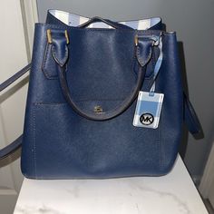 Michael Kors Large Grab Bag Leather Basically Brand New Comes With Wallet Adjustable Strap (Wallet & Purse Purchased Separately) -Purse $398 -Wallet $128 Blue Rectangular Bag With Interior Card Slots, Blue Travel Bag With Interior Card Slots, Classic Blue Pouch Bag, Blue Shoulder Bag With Interior Card Slots For Travel, Blue Travel Shoulder Bag With Interior Card Slots, Blue Bag With Interior Card Slots For Everyday Use, Blue Bags With Interior Card Slots For Everyday Use, Blue Everyday Bag With Interior Card Slots, Blue Shoulder Bag With Card Slots For Everyday Use