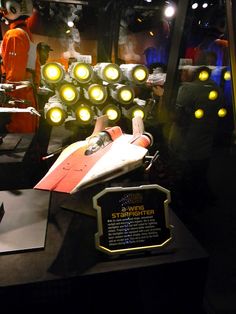 a display case filled with lots of different types of lights and items on top of it