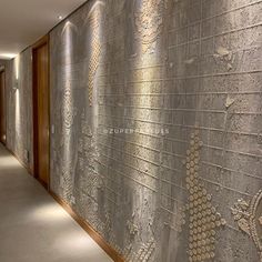 the wall is made up of silver tiles