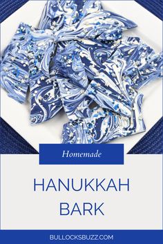 blue and white napkins on a plate with the words hanukkah bark