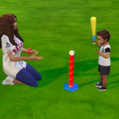 a woman kneeling down next to a little boy holding a baseball bat and hitting a ball