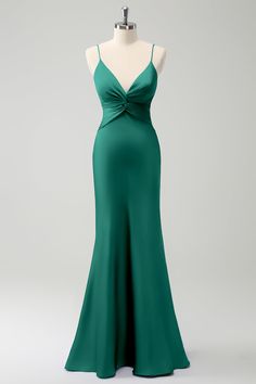 a green evening gown on a mannequin