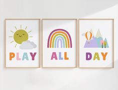 three children's wall art prints with the words play all day, rainbow and sun