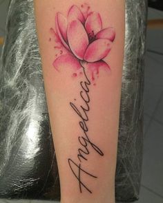 a pink flower with the word faith written in cursive writing on its arm