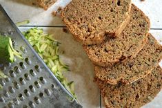 sliced zucchini bread sitting on top of a cutting board