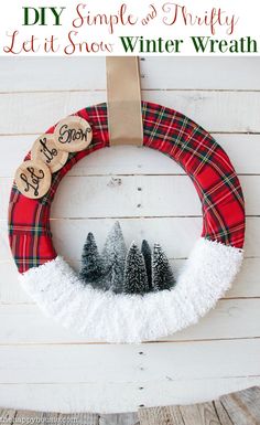 a christmas wreath hanging on the side of a wall